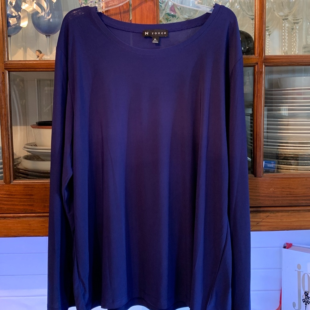 Beautiful bluish purple N Touch poly spandex blouse. Never worn